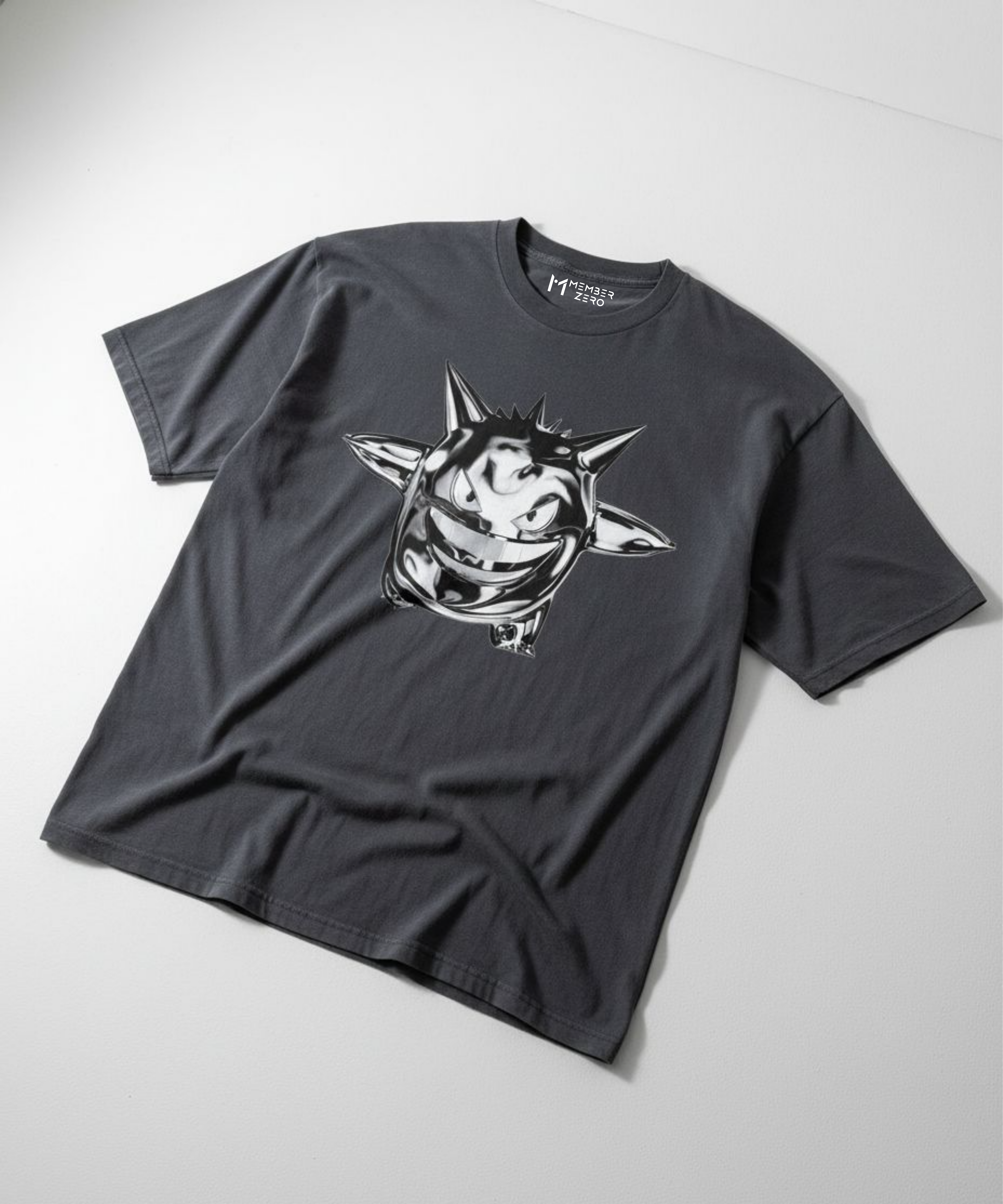 Gray t-shirt with a chrome gengar graphic design on a white background